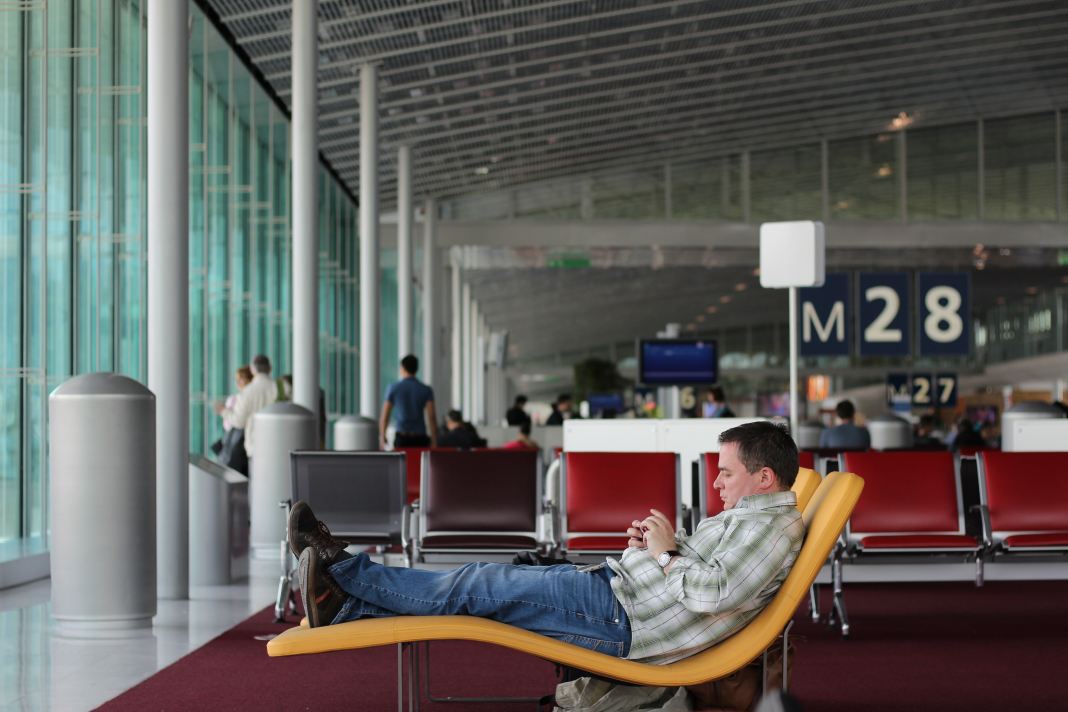 Man lounging in an airport